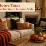 A cozy living room decorated for fall with warm colors and pumpkins.